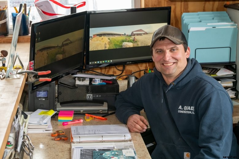 Brad Kruger sits at his desk